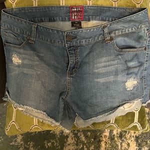 Distressed denim short.